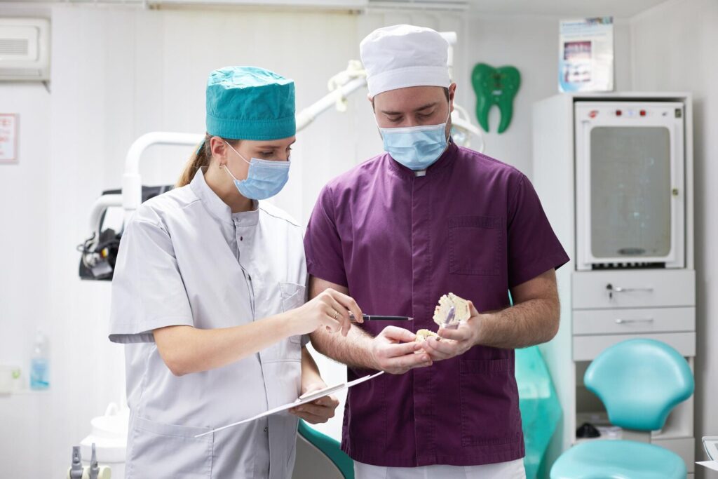Team doctors orthodontists doctors agree patient s dental treatment according xray film 695242 1532
